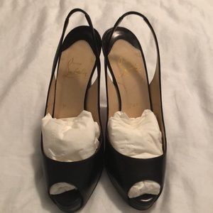 Black leather Christian Louboutin sling back pumps